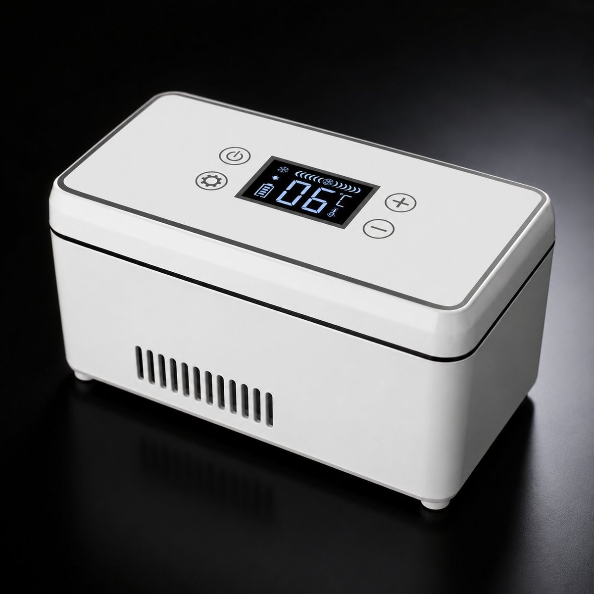 White portable insulin cooler box with open lid showing cooling compartments inside, sitting on marble surface